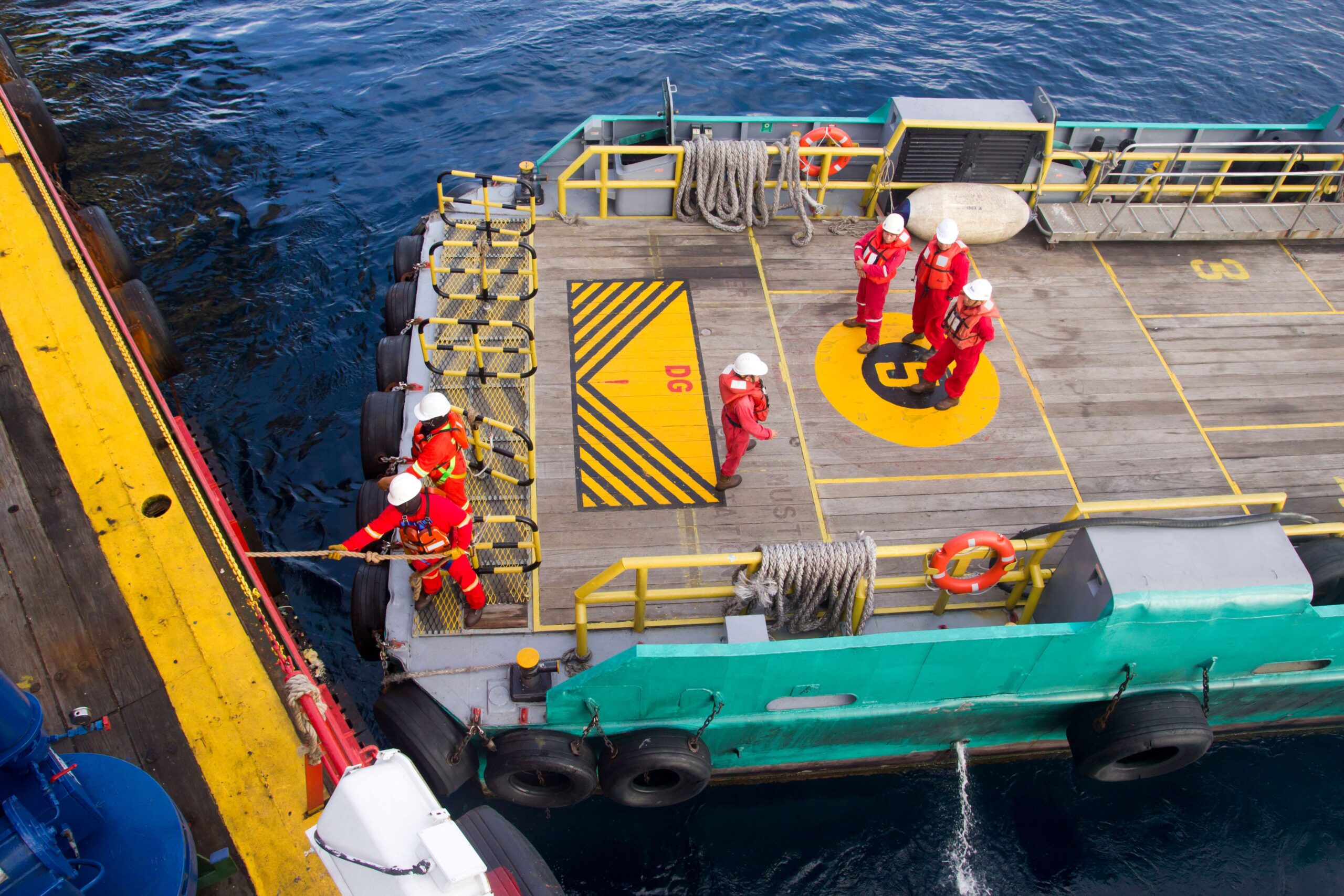 Workers on offshore vessel backdeck